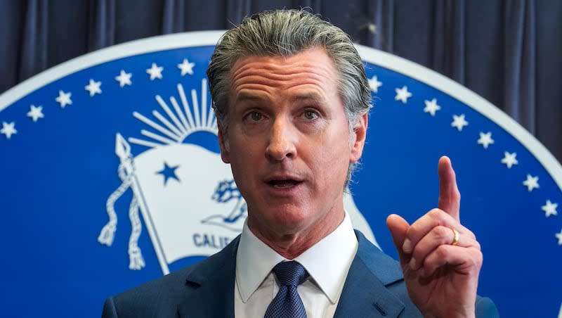 California Gov. Gavin Newsom celebrates the passing of Proposition 1, a $6.4 billion bond ballot measure, during a news conference at the Ronald Reagan State Building, Thursday, March 21, 2024, in Los Angeles. California voters passed the measure that will impose strict requirements on counties to spend on housing and drug treatment programs to tackle the state's homelessness crisis.