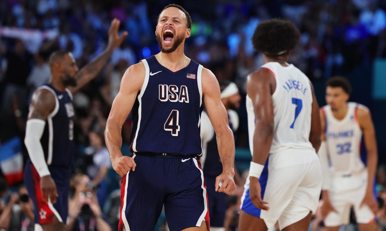 <span>Stephen Curry celebrate during the men’s Olympic basketball final.</span><span>Photograph: David Levene/The Observer</span>