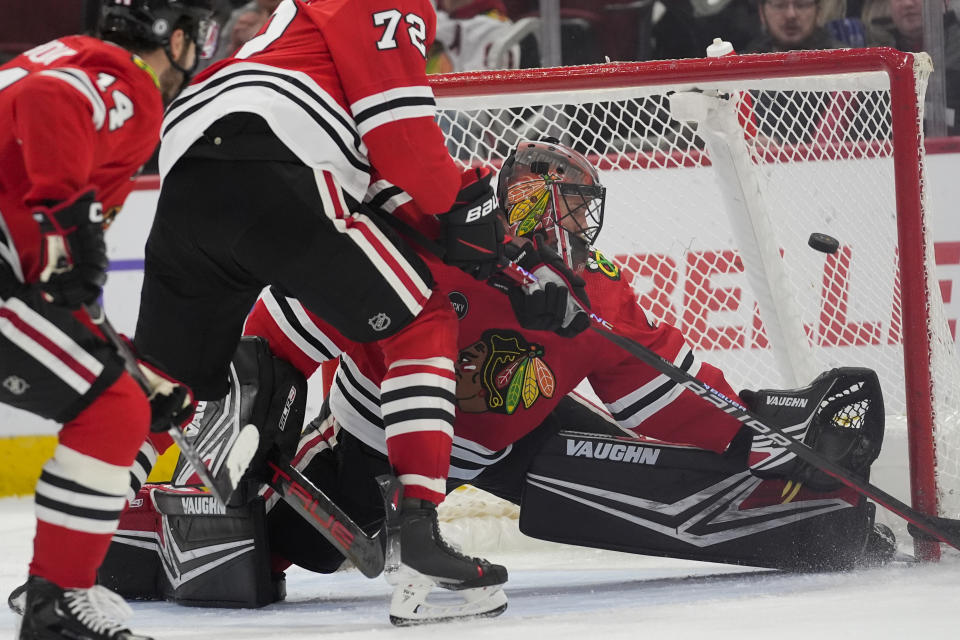 Chicago Blackhawks goaltender Arvid Soderblom gives up a goal to Pittsburgh Penguins' Sidney Crosby during the third period of an NHL hockey game, Thursday, Feb. 15, 2024, in Chicago. The Penguins won 4-1. (AP Photo/Erin Hooley)