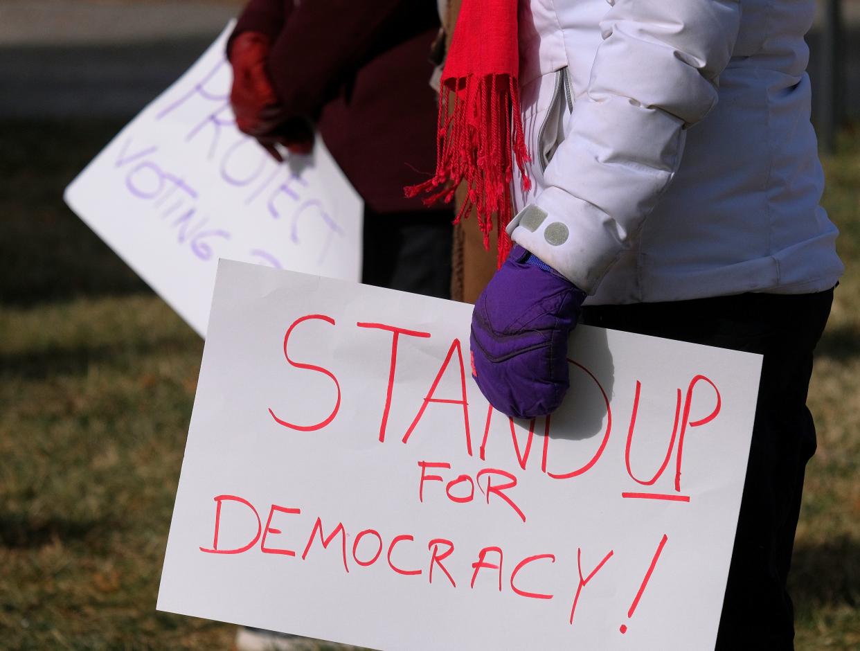 People gather at the Change Oklahoma Vigil for Democracy and Day of Remembrance for the Capitol Insurrection one year ago, at First Unitarian Church in Oklahoma City Thursday, January 6, 2021.