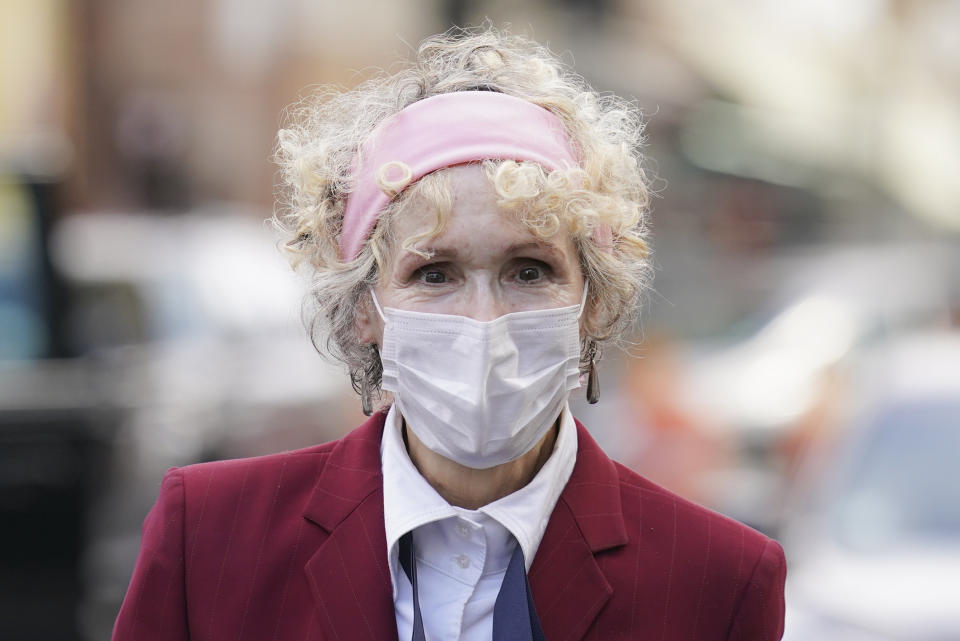 E. Jean Carroll arrives at the Daniel Patrick Moynihan United States Courthouse, Wednesday, Oct. 21, 2020, in New York. Carroll, who says President Donald Trump raped her in the 1990s, was expected to be in court Wednesday to hear lawyers argue whether Trump can substitute the United States for himself as the defendant in her defamation lawsuit. (AP Photo/John Minchillo)