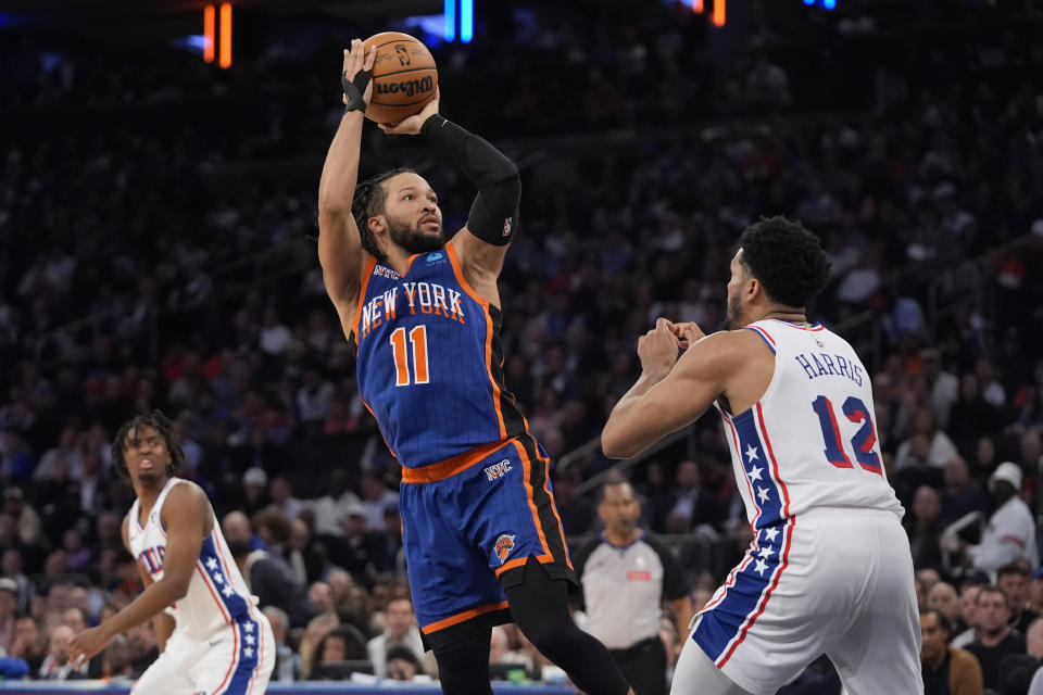 New York Knicks' Jalen Brunson (11) shoots over Philadelphia 76ers' Tobias Harris (12) during the second half of Game 5 in an NBA basketball first-round playoff series, Tuesday, April 30, 2024, in New York. (AP Photo/Frank Franklin II)