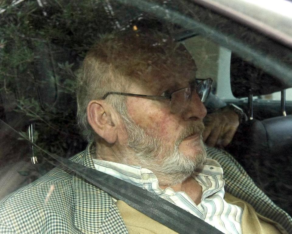 Jean-Claude Mas, the founder of Poly Implant Prothese, leaves the courthouse of Marseille, southern France, Tuesday, Dec. 10, 2013. A court has ruled that the French businessman who sold tens of thousands of faulty silicone breast implants around the world is guilty of fraud. With dozens of women looking on, the Marseille tribunal handed Jean-Claude Mas, the founder of Poly Implant Prothese, the maximum four-year prison sentence on the aggravated fraud charge. He was also ordered to pay a 75,000-euro ($103,000) fine. (AP Photo/Claude Paris)