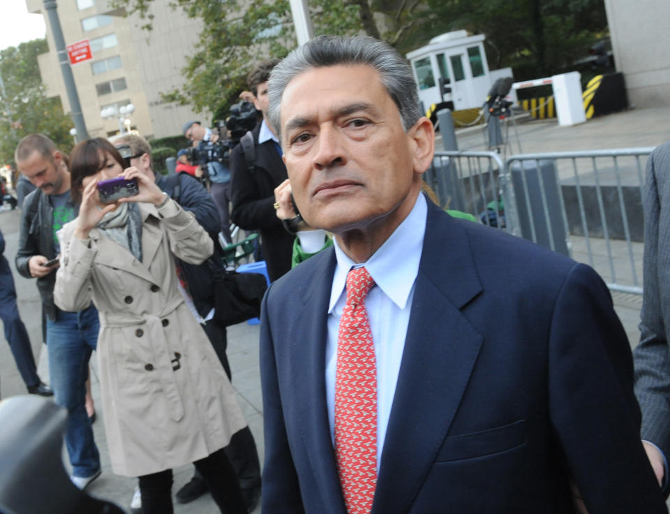 In this Oct. 26, 2011 photo, Rajat Gupta exits Manhattan federal court in New York following arraignment. The insider trading trial of the former board member for Goldman Sachs and Procter & Gamble begins in New York on Monday, May 21, 2012, with jury selection. (AP Photo/ Louis Lanzano)