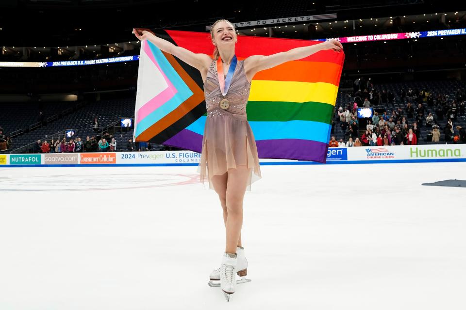 Amber Glenn takes a victory lap around the rink following her win at the 2024 U.S. Figure Skating Championships.