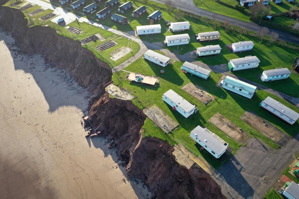 WITHERNSEA, UNITED KINGDOM - JANUARY 09:  Holiday chalets abandoned due to coastal erosion wait to be demolished or taken by the sea in the village of Withersea in the East Riding of Yorkshire on January 09, 2020 in Withernsea, United Kingdom. The effects of global warming and climate change creating storms and sea swells have seen the East Coast of the United Kingdom lose up to one metre of coast line each year.  Landslips and cliff falls caused by waterlogged land and sea erosion has claimed hundreds of roads, homes and holiday accommodation. (Photo by Christopher Furlong/Getty Images)