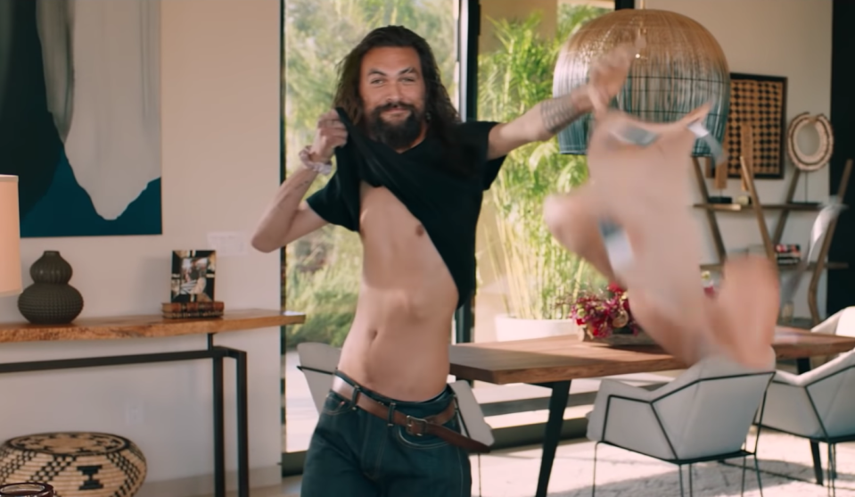 Momoa's ripped physique gets ripped away in his Super Bowl ad. (Rocket Mortgage/YouTube)