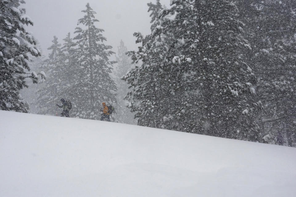 People ski during a blizzard, Sunday, March 3, 2024, in Olympic Valley, Calif. (AP Photo/Brooke Hess-Homeier)