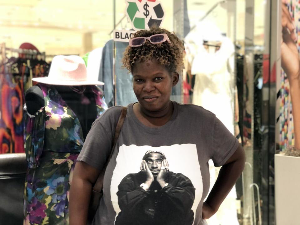 Latoya Hodson, 46, takes a break from browsing at Baldwin Hills Crenshaw Plaza in South Central Los Angeles.