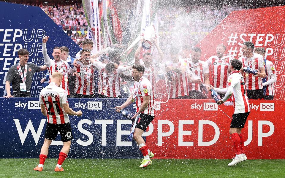 Corry Evans of Sunderland lifts the Sky Bet League One Play-Off trophy following victory in the Sky Bet League One Play-Off Final match between Sunderland and Wycombe Wanderers at Wembley - GETTY IMAGES