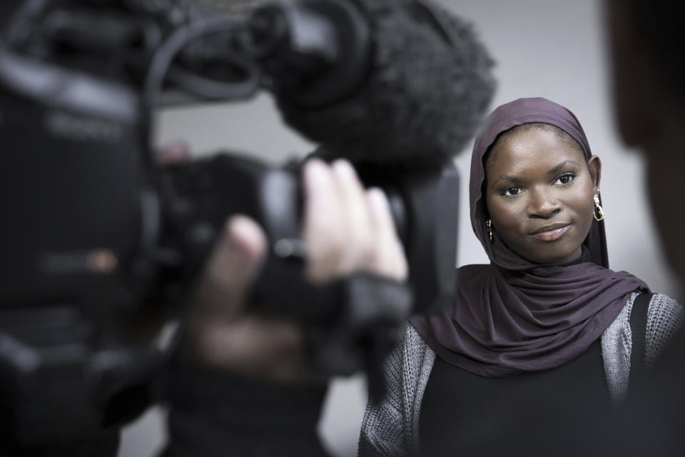 Olimatou Sonko, daughter of Gambia's former Interior Minister Ousman Sonko, and a lawyer in his defence team, talks to the media after the conviction of her father, in front of the Federal Criminal Court of Switzerland in Bellinzona, Wednesday, May 15, 2024. Switzerland’s top criminal court has convicted Ousman Sonko for crimes against humanity over the repression by the west African country’s security forces against opponents of its longtime dictator, a legal advocacy group said Wednesday. (Maria Linda Clericetti/Keystone via AP)