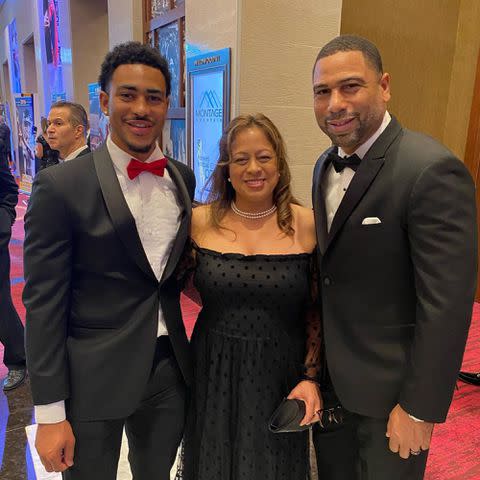 <p>Craig Young Instagram</p> Bryce Young with his parents, Julie and Craig Young, in 2022.