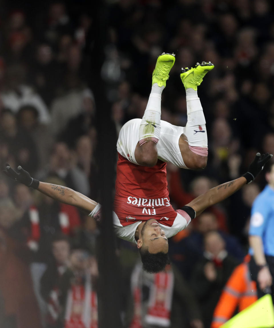 Arsenal's Pierre-Emerick Aubameyang celebrates after scoring his side's fourth goal during the English Premier League soccer match between Arsenal and Fulham at Emirates stadium in London, Tuesday, Jan. 1, 2019. (AP Photo/Kirsty Wigglesworth)