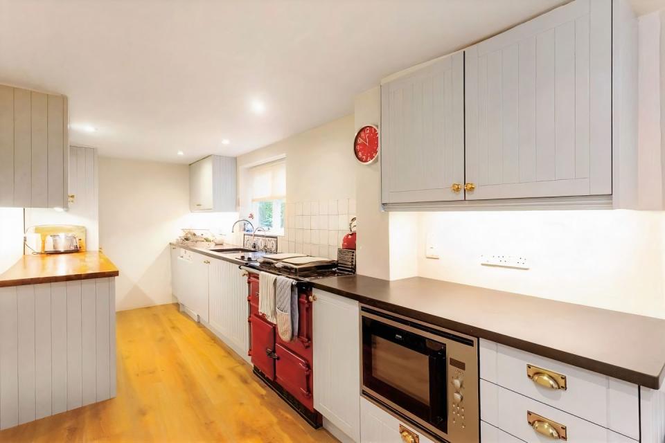 <p>The heart of this cottage, we love this smart grey shaker-style <a href="https://www.housebeautiful.com/uk/lifestyle/cleaning/a35306232/cleaning-kitchen-white-vinegar/" rel="nofollow noopener" target="_blank" data-ylk="slk:kitchen;elm:context_link;itc:0;sec:content-canvas" class="link ">kitchen</a>. </p><p><strong>Like this article? <a href="https://hearst.emsecure.net/optiext/cr.aspx?ID=DR9UY9ko5HvLAHeexA2ngSL3t49WvQXSjQZAAXe9gg0Rhtz8pxOWix3TXd_WRbE3fnbQEBkC%2BEWZDx" rel="nofollow noopener" target="_blank" data-ylk="slk:Sign up to our newsletter;elm:context_link;itc:0;sec:content-canvas" class="link ">Sign up to our newsletter</a> to get more articles like this delivered straight to your inbox.</strong></p><p><a class="link " href="https://hearst.emsecure.net/optiext/cr.aspx?ID=DR9UY9ko5HvLAHeexA2ngSL3t49WvQXSjQZAAXe9gg0Rhtz8pxOWix3TXd_WRbE3fnbQEBkC%2BEWZDx" rel="nofollow noopener" target="_blank" data-ylk="slk:SIGN UP;elm:context_link;itc:0;sec:content-canvas">SIGN UP</a></p><p>In need of some positivity or not able to make it to the shops? <a href="https://go.redirectingat.com?id=127X1599956&url=https%3A%2F%2Fwww.hearstmagazines.co.uk%2Fhb%2Fhouse-beautiful-magazine-subscription-website&sref=https%3A%2F%2Fwww.housebeautiful.com%2Fuk%2Flifestyle%2Fproperty%2Fg35456956%2Fchocolate-box-cottages-for-sale%2F" rel="nofollow noopener" target="_blank" data-ylk="slk:Subscribe to House Beautiful magazine today;elm:context_link;itc:0;sec:content-canvas" class="link ">Subscribe to House Beautiful magazine today</a> and get each issue delivered directly to your door.</p>