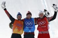 Freestyle Skiing - Pyeongchang 2018 Winter Olympics - Men's Ski Cross Finals - Phoenix Snow Park - Pyeongchang, South Korea - February 21, 2018 - Silver medallist Marc Bischofberger of Switzerland, gold medallist Brady Leman of Canada and bronze medallist Sergey Ridzik, an Olympic athlete from Russia, celebrate. REUTERS/Issei Kato