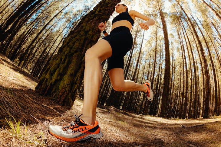 A woman running in the forest