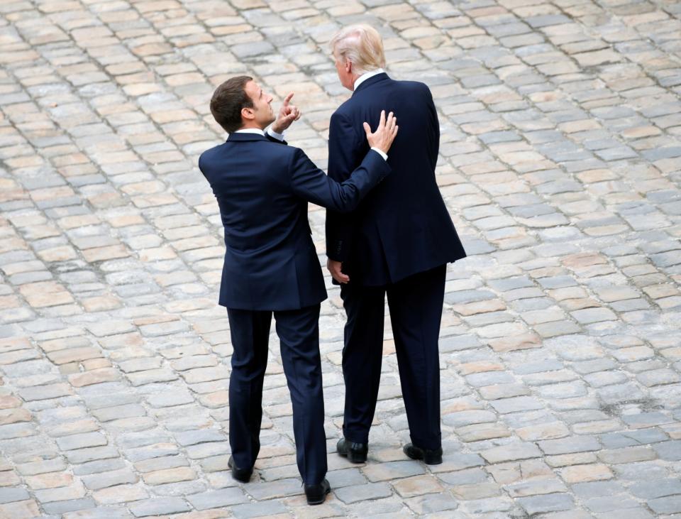 <p>French President Emmanuel Macron and President Donald Trump attend a welcoming ceremony at the Invalides in Paris, France, July 13, 2017. (Photo: Kevin Lamarque/Reuters) </p>