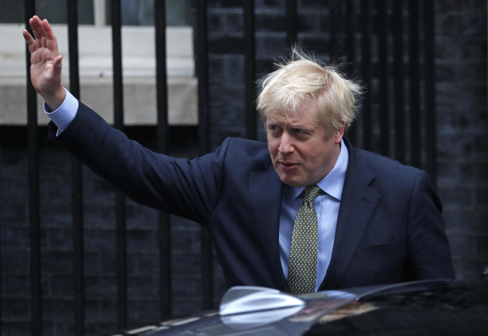 Britain's Prime Minister Boris Johnson leaves number 10 Downing Street in London, Friday, Dec. 13, 2019 on his way to meet Queen Elizabeth II to seek her approval to form a new government. Prime Minister Boris Johnson's Conservative Party has won a solid majority of seats in Britain's Parliament — a decisive outcome to a Brexit-dominated election that should allow Johnson to fulfill his plan to take the U.K. out of the European Union next month. (AP Photo/Frank Augstein)