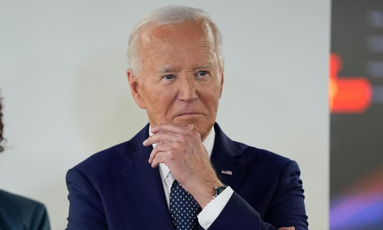 <span>Biden listens during a visit to the DC Emergency Operations Center on 2 July 2024.</span><span>Photograph: Evan Vucci/AP</span>