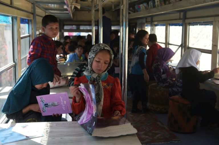 The vehicle is a relatively secure place for the children to read, play chess and see friends