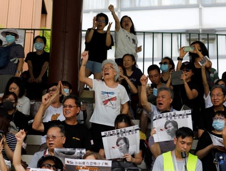 People shout slogans at a protest in Hong Kong