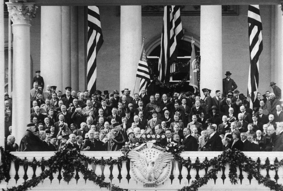 Calvin Coolidge takes the oath of office at the&nbsp;inaugural ceremony on March 4, 1925, after he was elected to a full term. William Howard Taft, a Supreme Court justice and former president, presides over the ceremony.