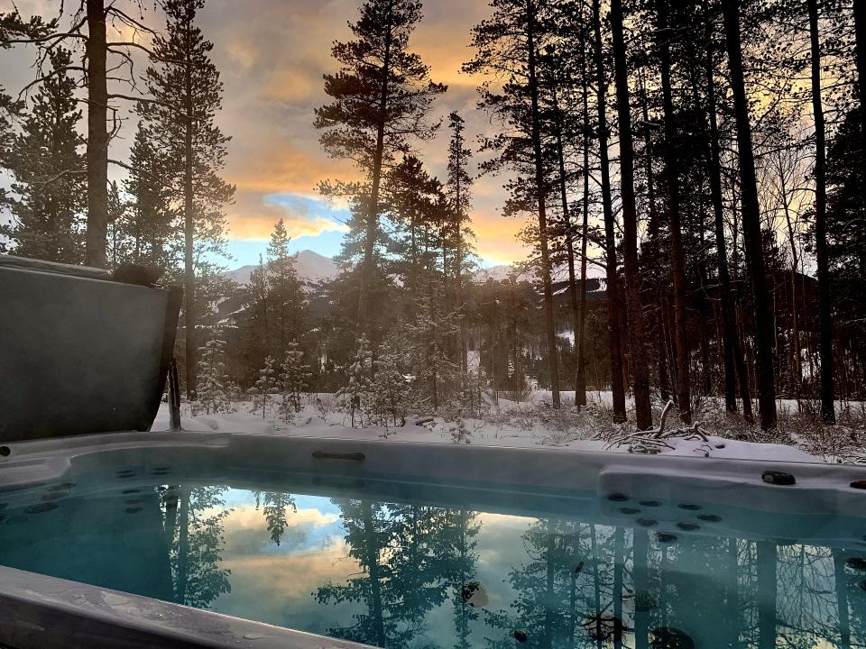 A heated pathway leads to an extra-deep $60,000 hot tub, where up to 14 people can soak in mountain views. Photo credit: Summit Luxury Estates.