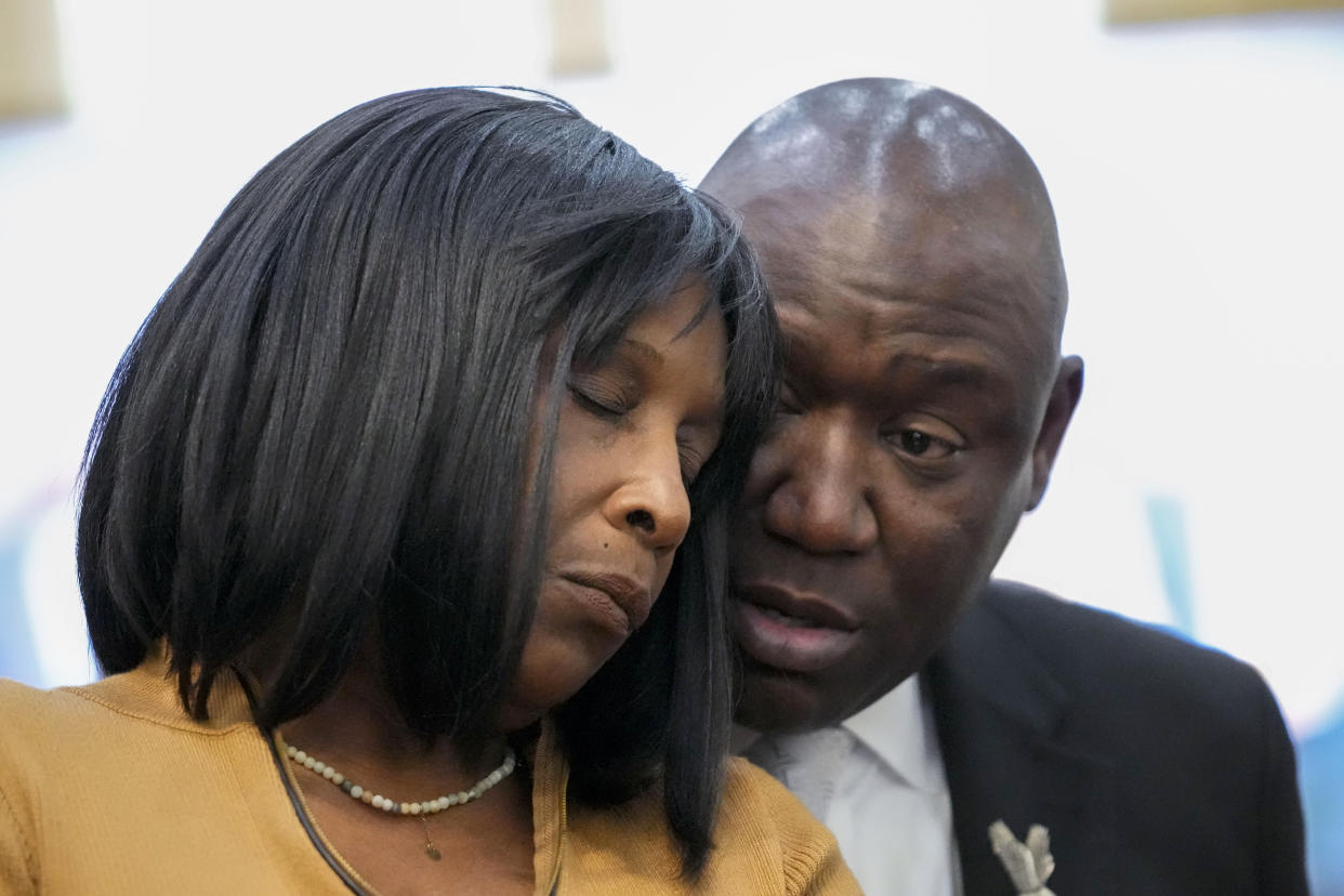 Civil rights Attorney Ben Crump speaks to RowVaughn Wells, mother of Tyre Nichols, who died after being beaten by Memphis police officers, at a news conference with in Memphis, Tenn., Friday, Jan. 27, 2023. (AP Photo/Gerald Herbert)