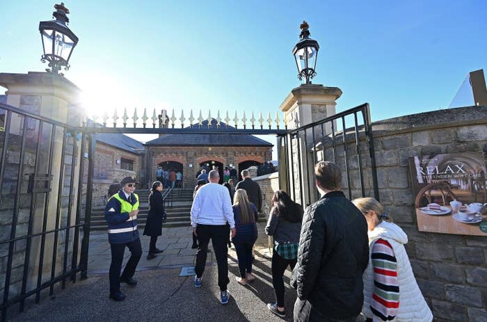 Members of the public and tourists queue to visit Windsor Castle on Thursday as it reopened to visitors following the death of Queen Elizabeth II.