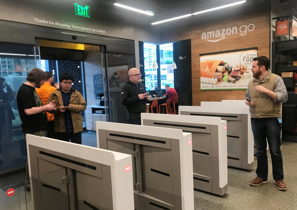 Shoppers enter the Amazon Go store in Seattle – the first supermarket without checkouts or till (REUTERS/Jeffrey Dastin)