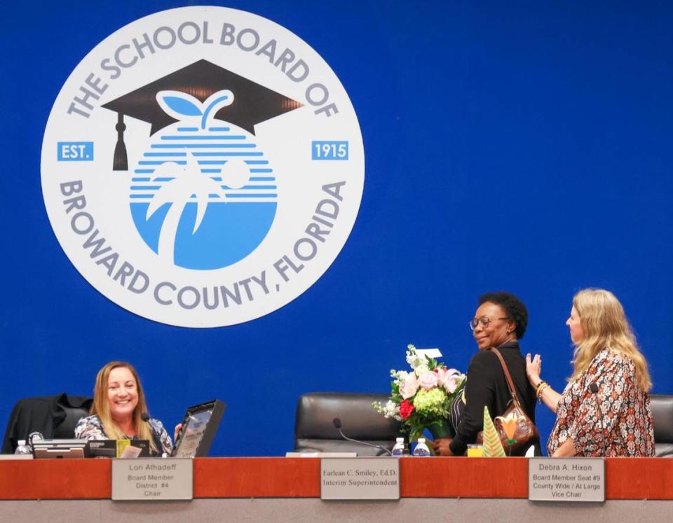 Lori Alhadeff, board chair, right, holds a plaque of appreciation as former interim superintendent, Earlean Smiley, vacates her seat with flowers and a pat on the back from Debra Hixon, vice chair, right. The Broward School Board held special meeting to vote on the new superintendent’s contract inside the Board Room at the Kathleen C. Wright Building in Fort Lauderdale, Florida on Tuesday, July 11, 2023.
