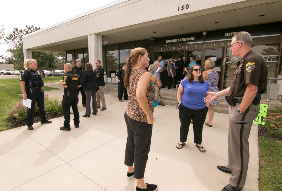 Livingston County Sheriff Mike Murphy, right, and fellow members of the department meet with supporters of local law enforcement Wednesday, Sept. 2, 2020 in front of the sheriff’s office.