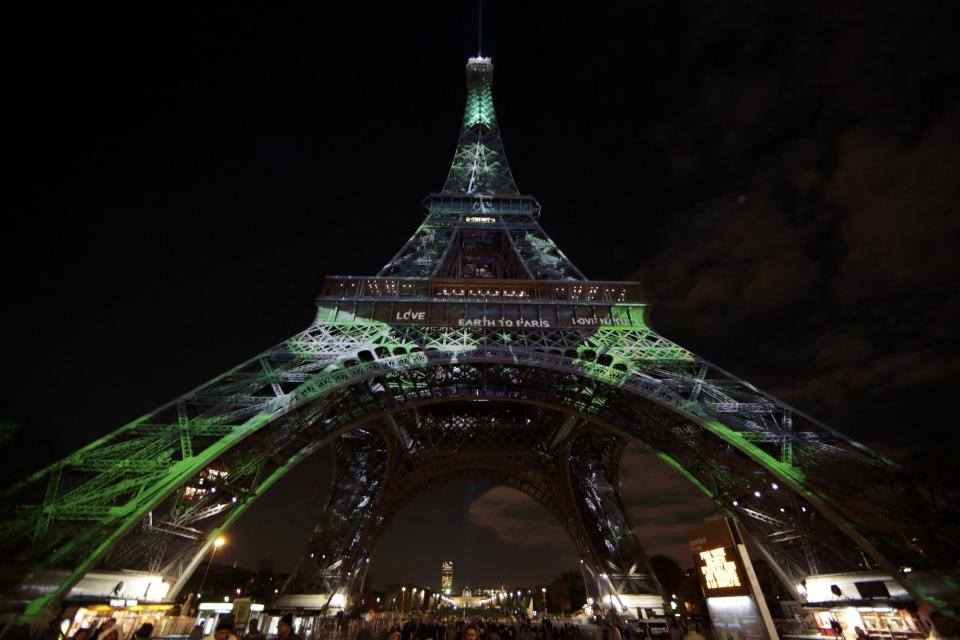 The Eiffel Tower is lit with green lights as part of the events in the French capital to mark the World Climate Change Conference 2015 (COP21), in Paris, France, December 2, 2015. (Eric Gaillard/Reuters)