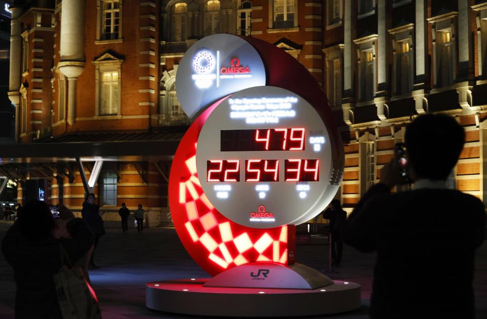 The countdown clock is shown at Tokyo 2020 Countdown Clock in front of Tokyo Station in Tokyo Monday, March 30, 2020. Tokyo organizers said Monday the opening ceremony will take place on July 23, 2021. (Kyodo News via AP)