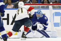 Tampa Bay Lightning goaltender Andrei Vasilevskiy (88) makes a save on a shot by Florida Panthers center Chris Tierney (71) during the second period of an NHL preseason hockey game Saturday, Oct. 8, 2022, in Tampa, Fla. (AP Photo/Chris O'Meara)