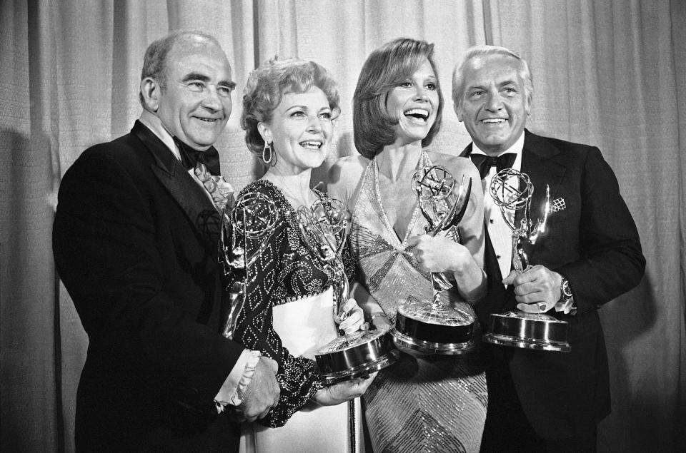 FILE - In this May 18, 1976 file photo, cast members of the "Mary Tyler Moore Show," pose with their Emmys backstage, at the 28th annual Emmy Awards in Los Angeles. From left are, Ed Asner, Betty White, Mary Tyler Moore and Ted Knight. Betty White, whose saucy, up-for-anything charm made her a television mainstay for more than 60 years, has died. She was 99. (AP Photo/Reed Saxon, file)