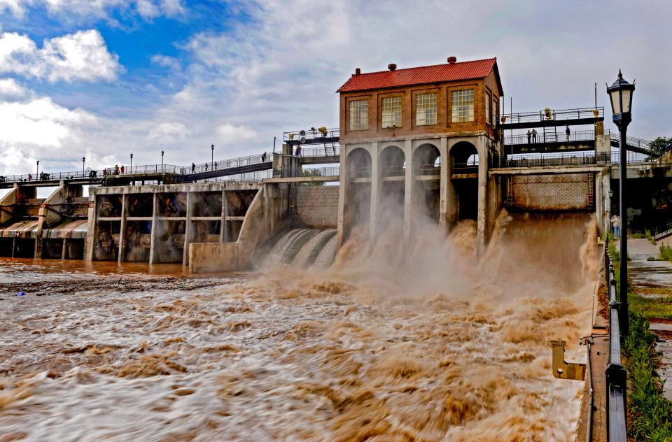 Water flows at the Overholser Dam in Oklahoma City on May 9, 2015, after days of heavy rain in central Oklahoma. A joint investigation by The Oklahoman and USA Today revealed the dam is in poor shape and how much of Oklahoma City would be devastated by flooding if the dam breaks.