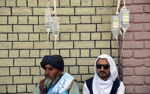 Members of the convoy are treated for dehydration - Credit: AP