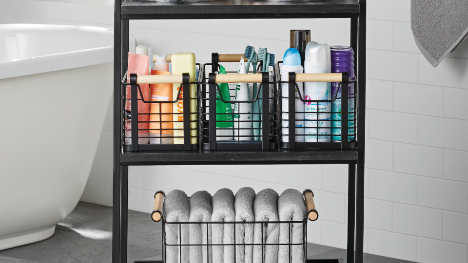 a storage cart stocked for a guest bathroom from the book stay organized by the home edit