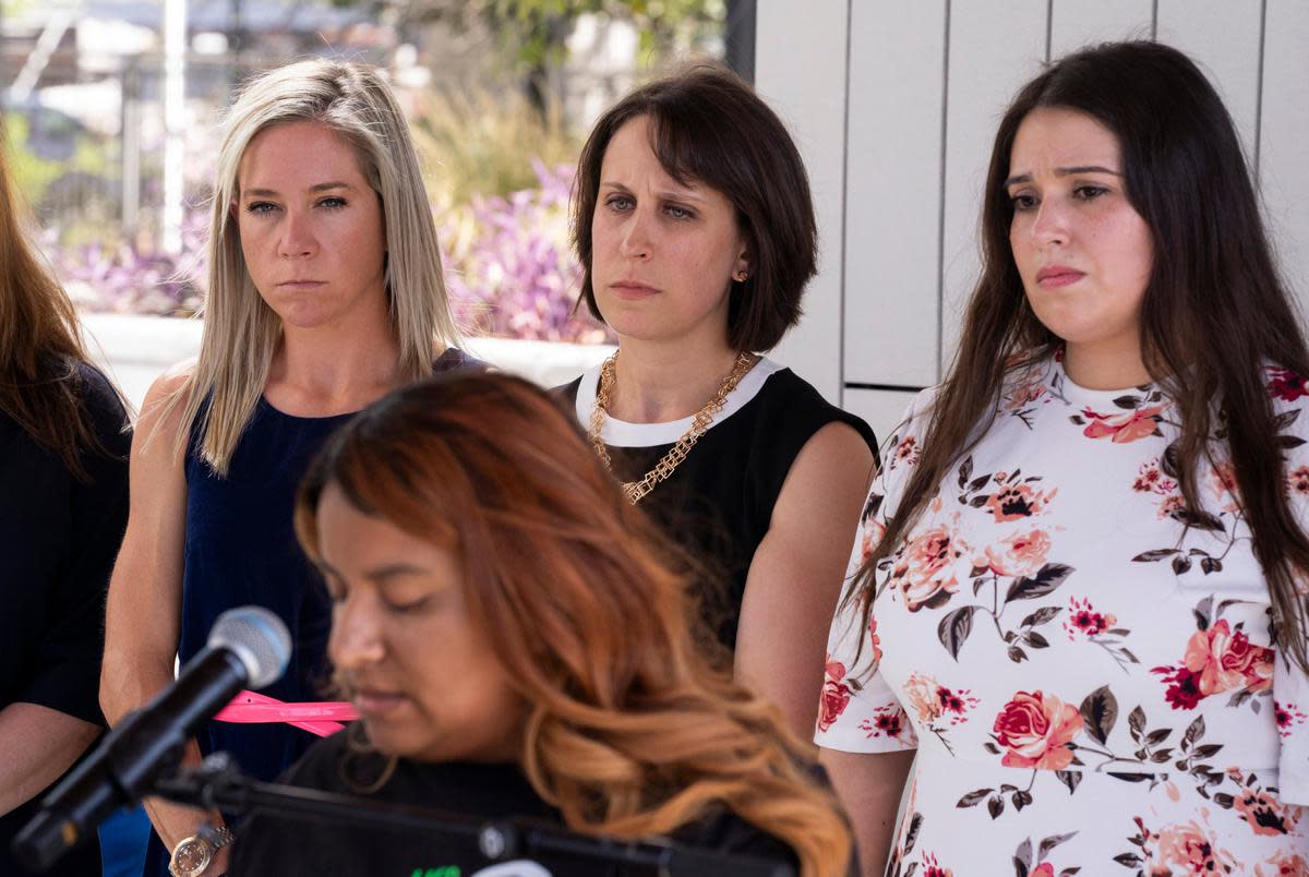 Amanda Zurawski, Molly Duane and Ashley Brandt look on as Samantha Casiano addresses the press following the first day of testimony for Zurawski v. State of Texas outside the Travis County Civil and Family Courts Facility in Austin on July 19, 2023.