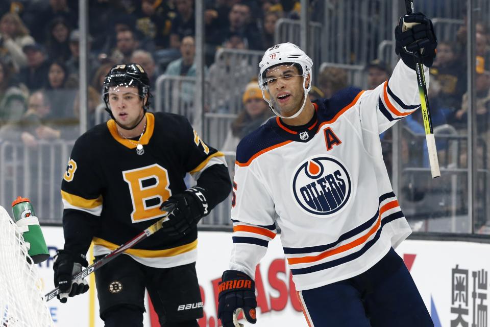 Edmonton Oilers' Darnell Nurse (25) celebrates his goal in front of Boston Bruins' Charlie McAvoy (73) during the second period on an NHL hockey game in Boston, Saturday, Jan. 4, 2020. (AP Photo/Michael Dwyer)