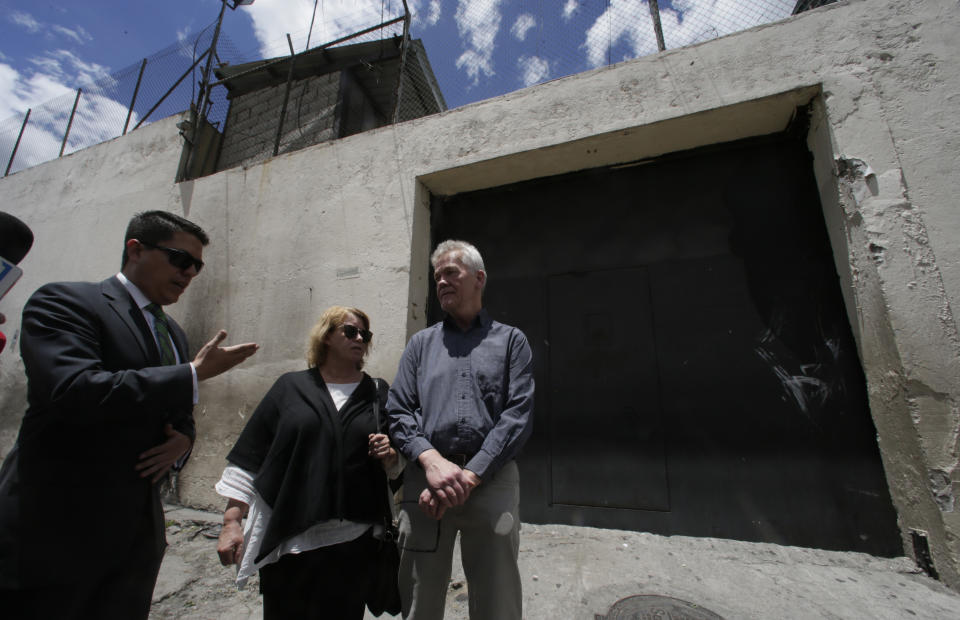 The parents of detained Swedish programmer Ola Bini, Gorel Bini, center, and Dag Gustafsson, right, talk with reporters accompanied by their son's lawyer, outside the provisional detention center where their son is being held in Quito, Ecuador, Tuesday, April 16, 2019. The ace Swedish programmer who was an early, ardent supporter of WikiLeaks was arrested in Ecuador last week in an alleged plot to blackmail the country's president over his abandonment of Julian Assange. (AP Photo/Dolores Ochoa)