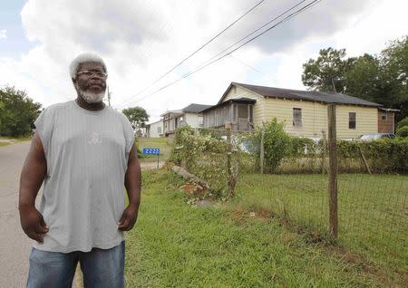 Frank Sanders walks through the Lincoln Park neighborhood in Thomaston, Georgia, U.S. August 16, 2016. REUTERS/Tami Chappell