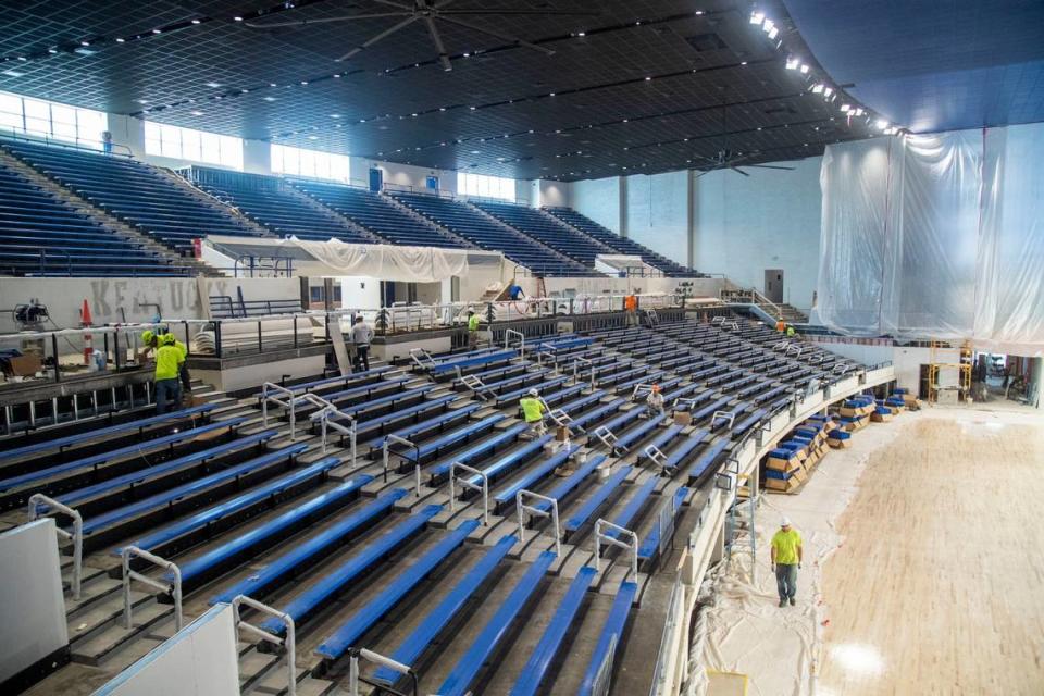 Construction workers complete renovations on the seating inside of Memorial Coliseum on July 12, with arena set to reopen later this year.