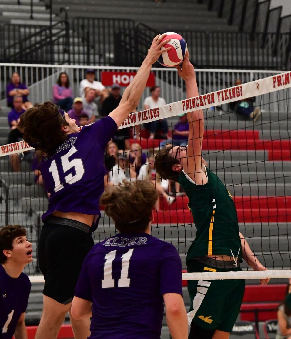Wil Busken (15) of Elder and Nathan Pratt (3) of Sycamore have a fingertip battle above the net at the OHSBVA South Region championships, May 28, 2022.