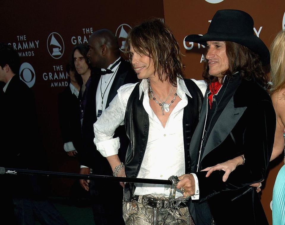 LOS ANGELES, CA - FEBRUARY 08:  Musicians Steven Tyler (L) and Joe Perry of Aerosmith arrive at the 48th Annual Grammy Awards at the Staples Center on February 8, 2006 in Los Angeles, California.  (Photo by Stephen Shugerman/Getty Images)