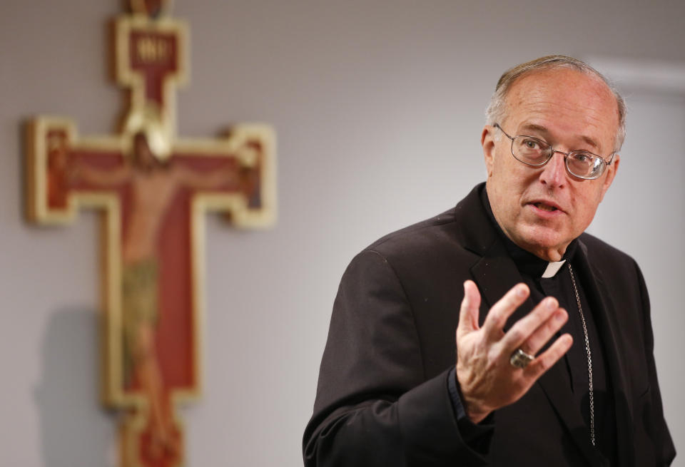 FILE - Bishop Robert W. McElroy speaks during a news conference in which he was introduced as the Bishop of the Diocese of San Diego Tuesday, March 3, 2015, in San Diego. When San Diego Bishop McElroy receives his prestigious red hat at the Vatican on Saturday, he will bring to the College of Cardinals a fervent loyalty to Pope Francis that has often put him at odds with the conservative majority in the U.S. Conference of Catholic Bishops. (AP Photo/Lenny Ignelzi, File)