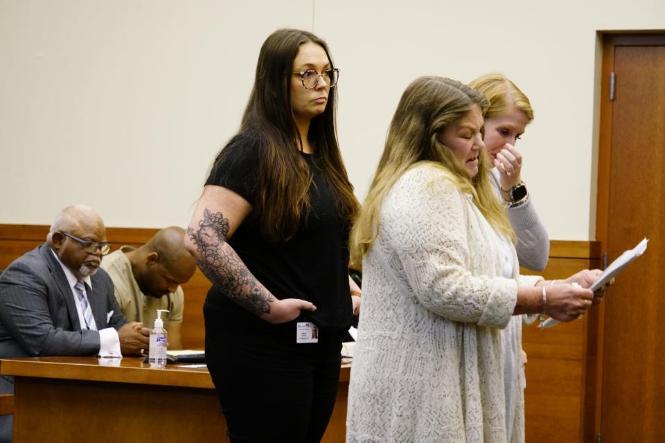 Lori Brown, right foreground, tells Franklin County Common Pleas Court Judge Jeffrey Brown (no relation) on Monday, Aug. 21, 2023 about how unbearable it was to lose her son, 29-year-old Kyle William Stewart, who was fatally stabbed on April, 22, 2019 outside a convenience store on Columbus' East Side. In the background, 35-year-old Ernest Murphy, second from left, hangs his head. Under a plea agreement arranged between Murphy's attorney and prosecutors, Murphy pleaded guilty Monday to involuntary manslaughter for stabbing Stewart. Judge Brown sentenced Stewart to 20 to 25 ½ years in prison.