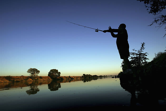 A fisherman casts his line (David McNew/Getty Images)