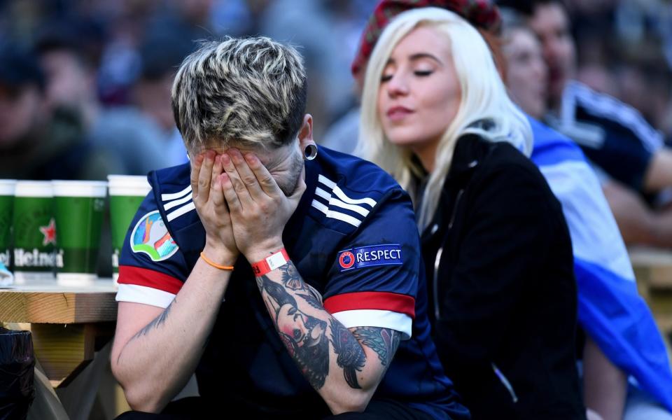 Scotland fans show their dejection as they support their team in the Euro 2020 game against Croatia on June 22, 2021 in Glasgow, Scotland. Scotland lost to Croatia, ending their Euro 2020 campaign. - GETTY IMAGES